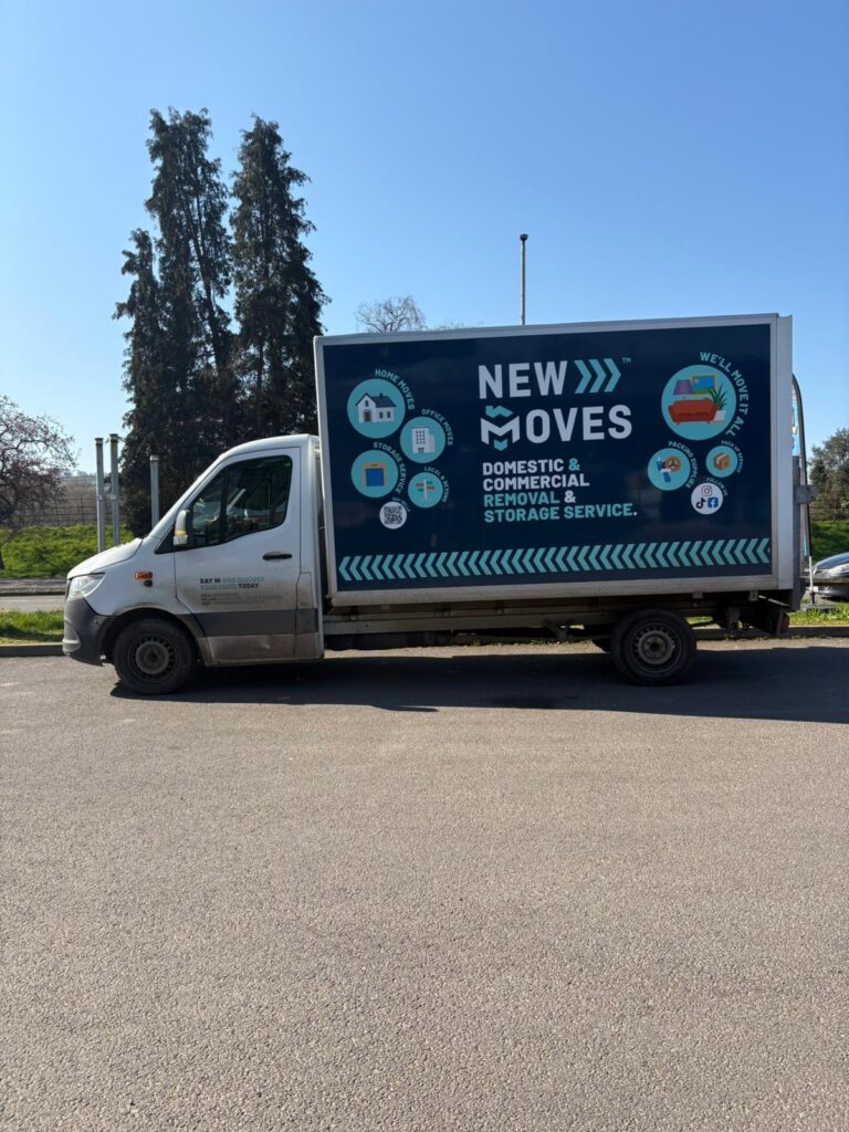New Moves branded removal van parked with its side livery visible, showing the company logo and service icons